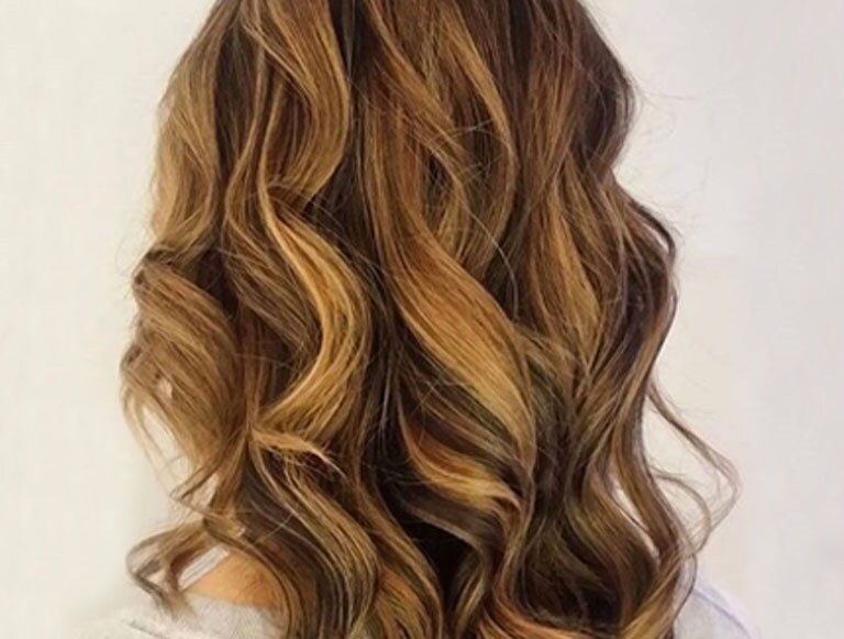 UGC image from Pinterest: warm light brunette highlights Aveda color by Aveda Artist Amie at Storm Hair Group in Canada.